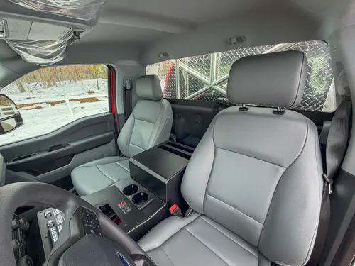 Front seats and center console with installed control module.